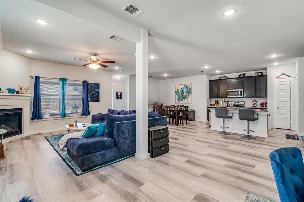 4204 Bullock Lane Forney, TX 75126 - Photo 8 of 25 a living room with furniture and a wooden floor