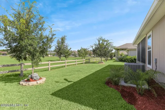 a view of a park with large trees