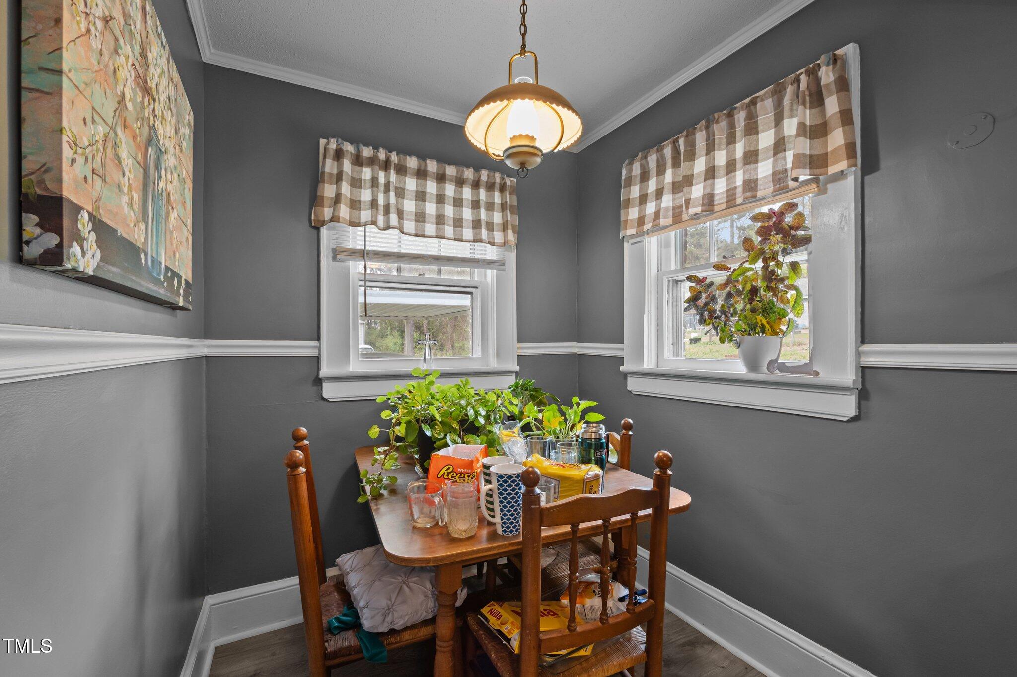 1823 East Geer Street Durham, NC 27704 - Photo 39 of 55 a dining room with furniture and window