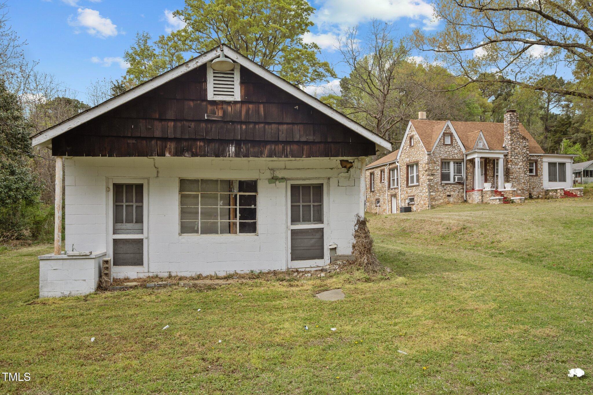 1823 East Geer Street Durham, NC 27704 - Photo 45 of 55 a front view of a house with a yard