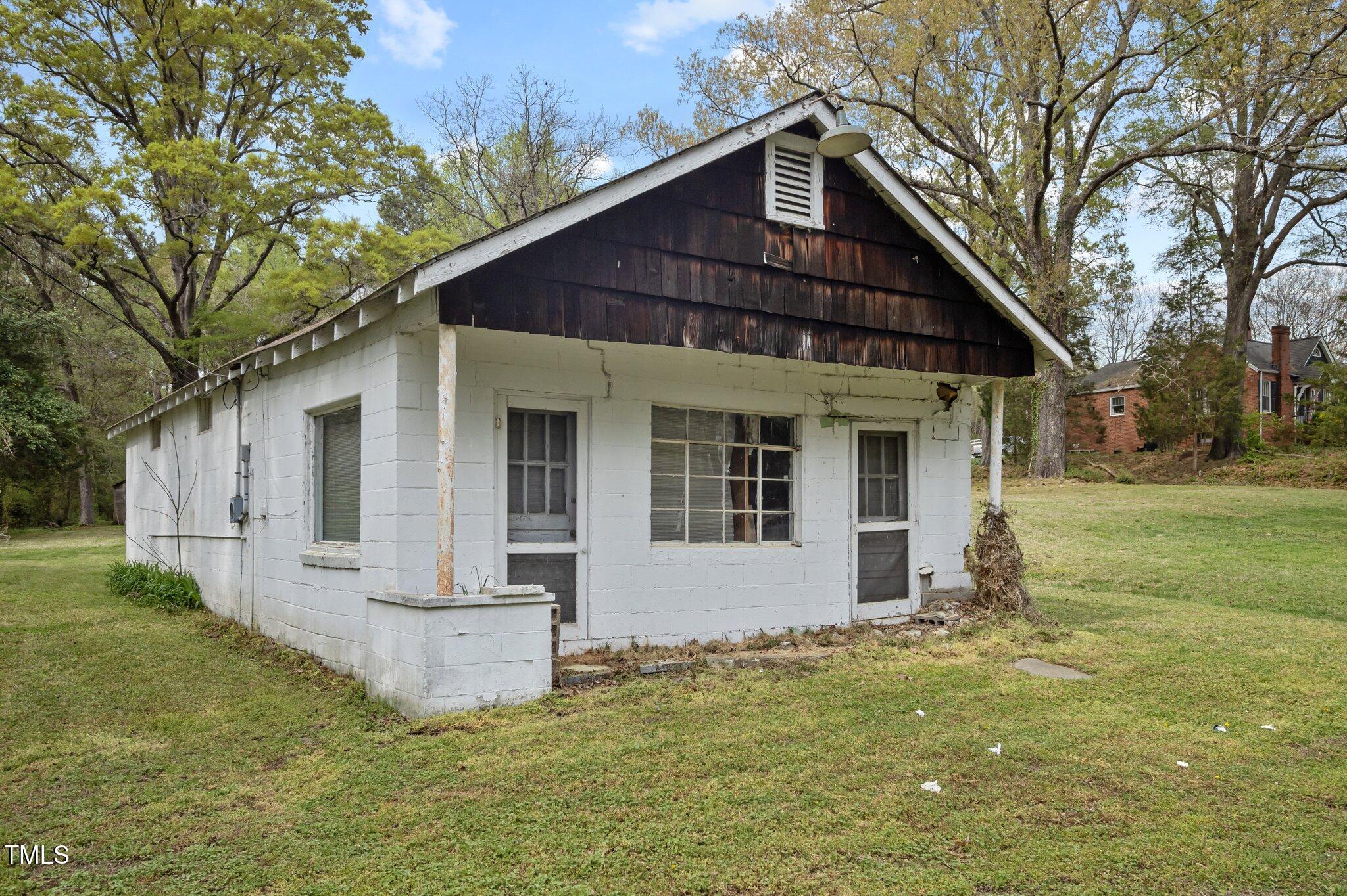 1823 East Geer Street Durham, NC 27704 - Photo 47 of 55 a front view of a house with a yard