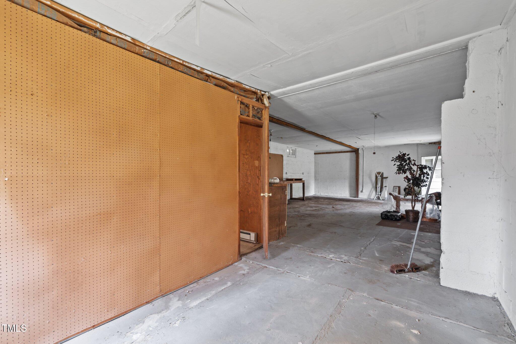 1823 East Geer Street Durham, NC 27704 - Photo 52 of 55 a view of a livingroom with walk in closet and storage