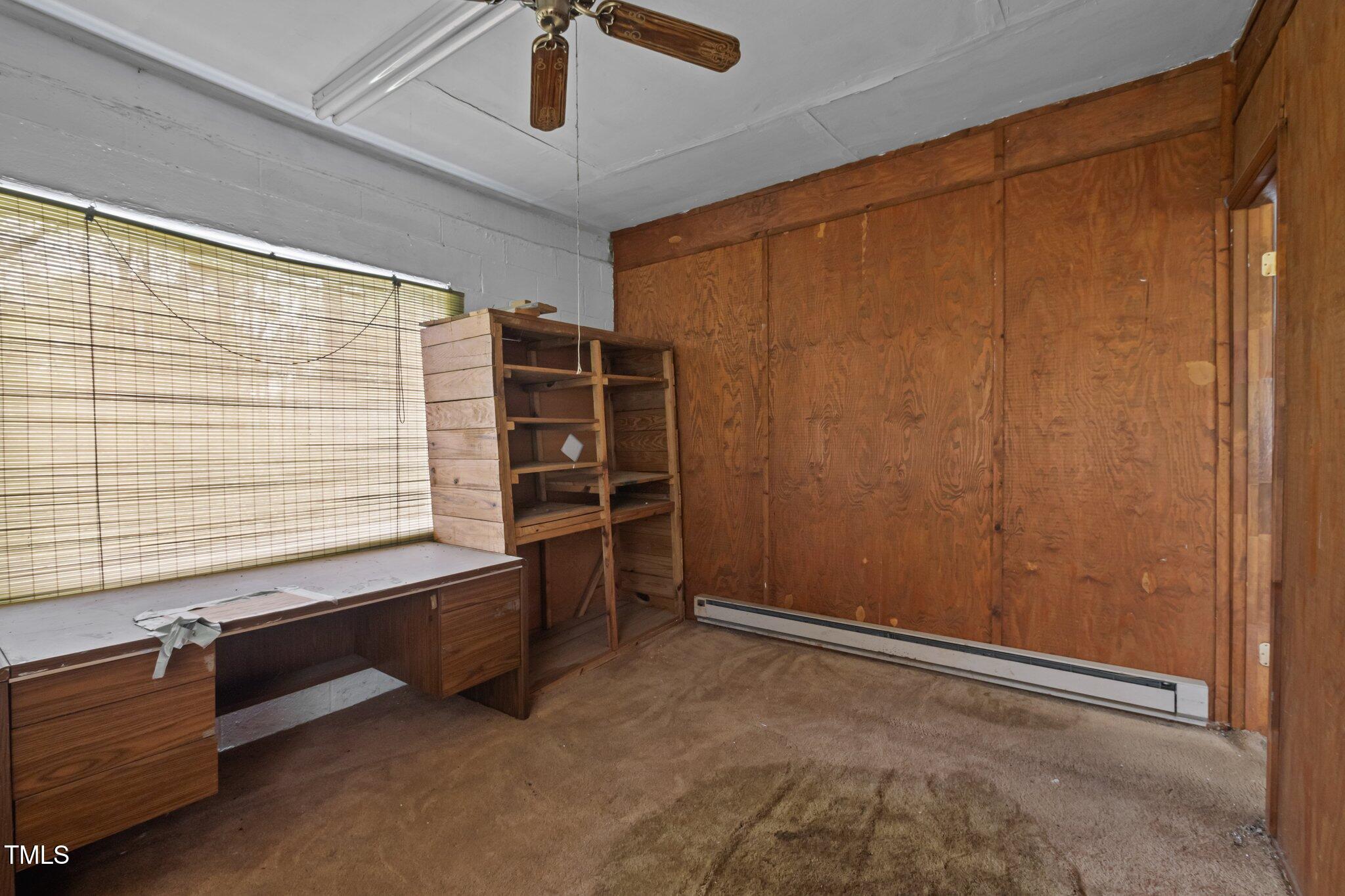 1823 East Geer Street Durham, NC 27704 - Photo 54 of 55 a room with furniture and a window