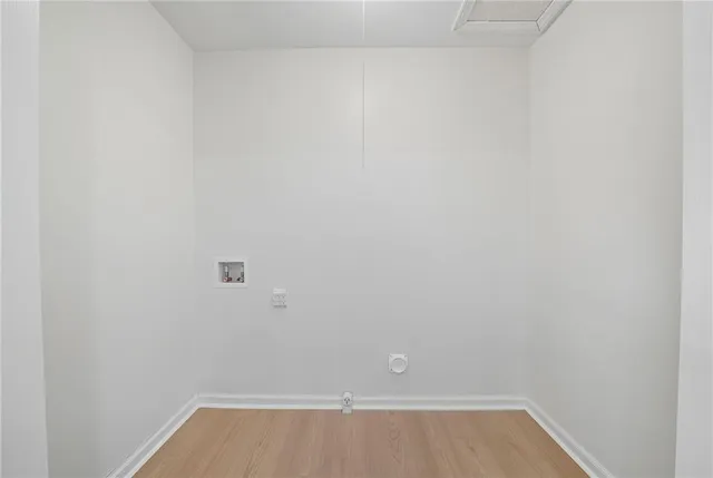 a view of a dining room with furniture wooden floor and next to a window