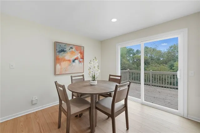 a balcony with wooden floor and fence