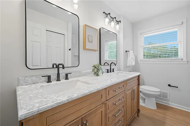 a white bath tub sitting next to a white toilet