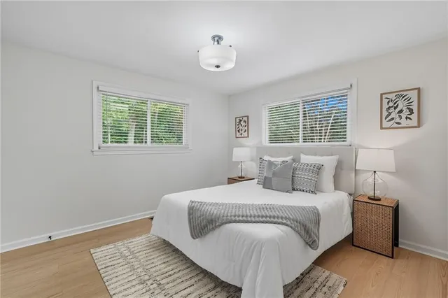 a bedroom with a bed and view of bathroom