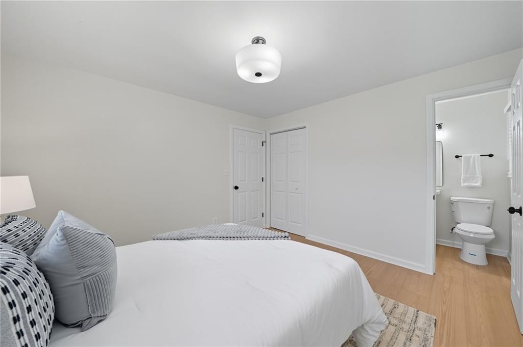 9 Chestnut Street Cartersville, GA 30120 - Photo 22 of 45 a bedroom with a bed and view of bathroom