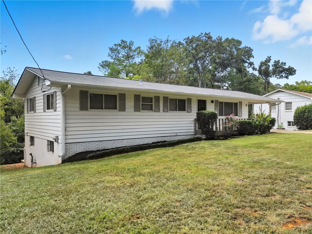 9 Chestnut Street Cartersville, GA 30120 - Photo 29 of 45 a view of a house with a backyard