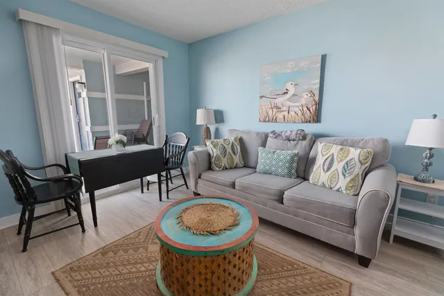a living room with furniture and a window