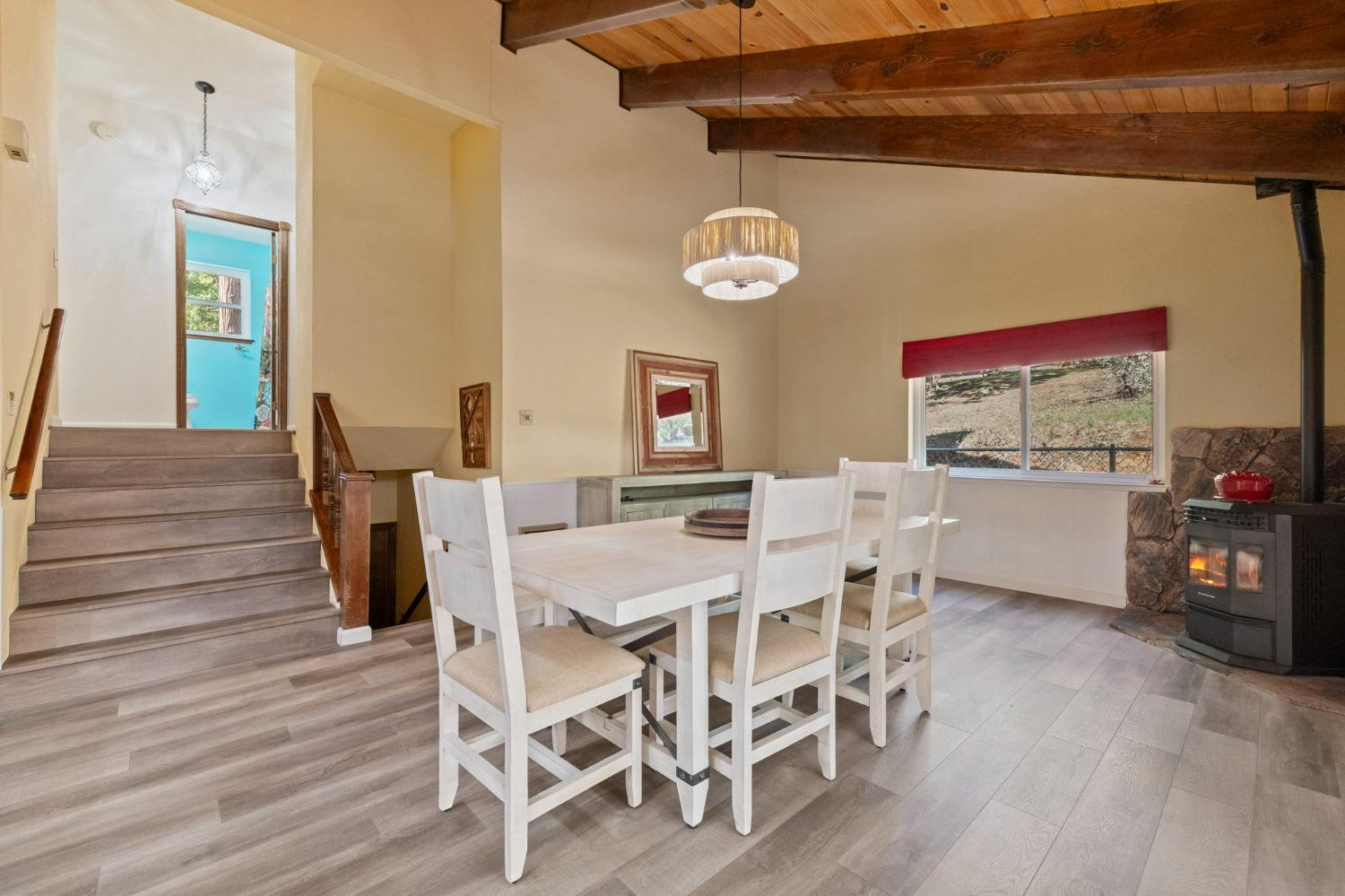 24014 Pine Cone Road Twain Harte, CA 95383 - Photo 12 of 43 a view of a dining room with furniture and wooden floor