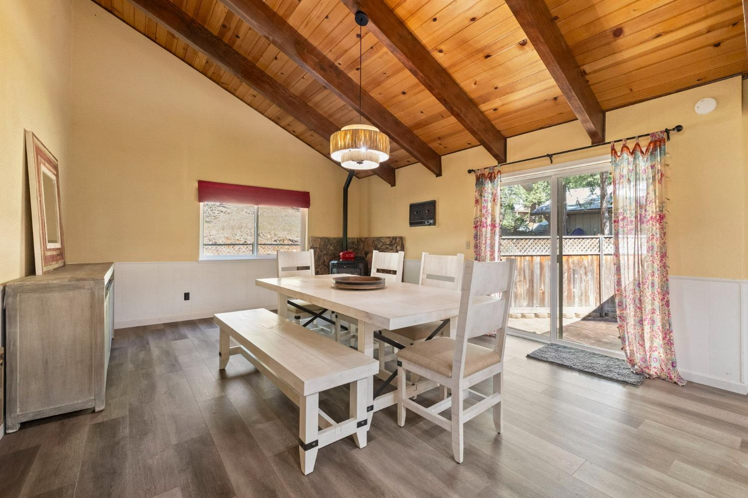 24014 Pine Cone Road Twain Harte, CA 95383 - Photo 14 of 43 a view of a dining room with furniture window and wooden floor