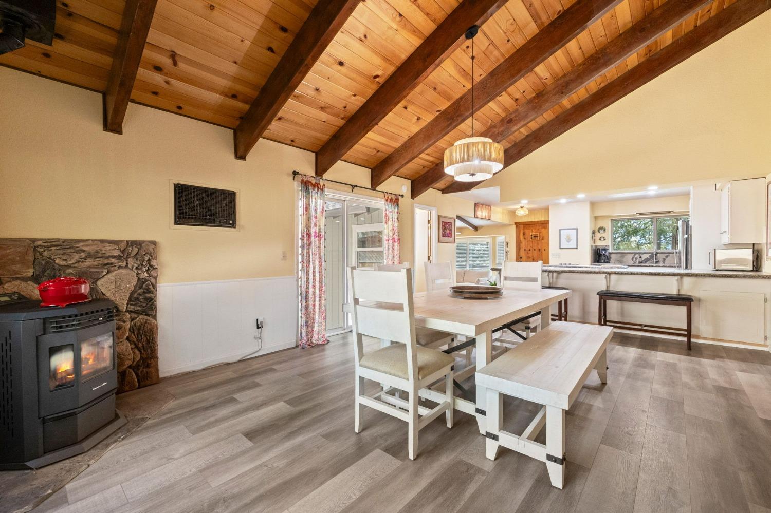 24014 Pine Cone Road Twain Harte, CA 95383 - Photo 15 of 43 a view of a dining room with furniture window and wooden floor
