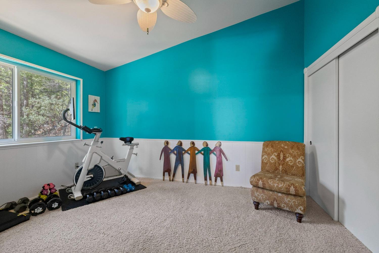 24014 Pine Cone Road Twain Harte, CA 95383 - Photo 18 of 43 a room with a couch and a potted plant