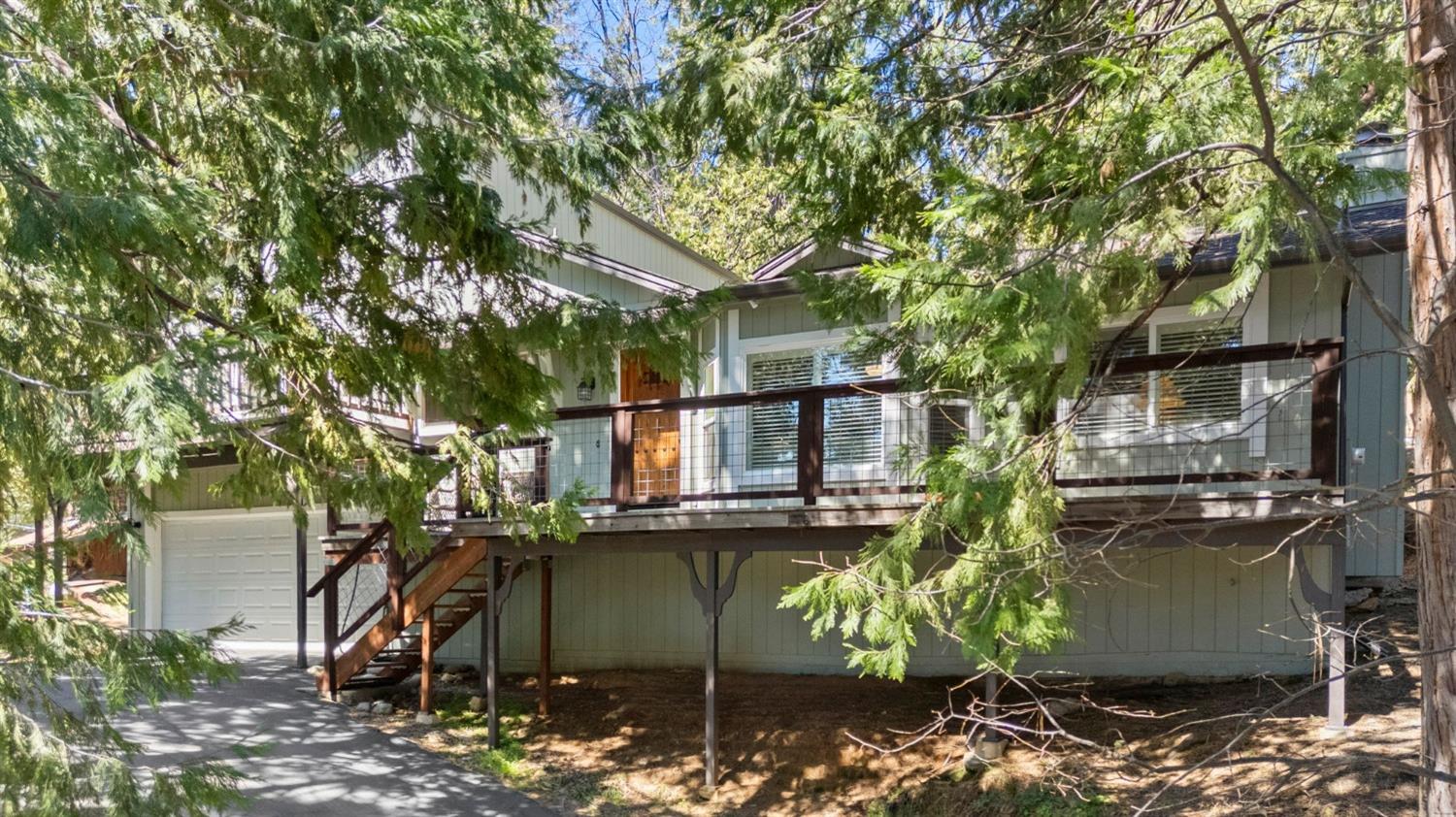 24014 Pine Cone Road Twain Harte, CA 95383 - Photo 28 of 43 a view of a house with a yard