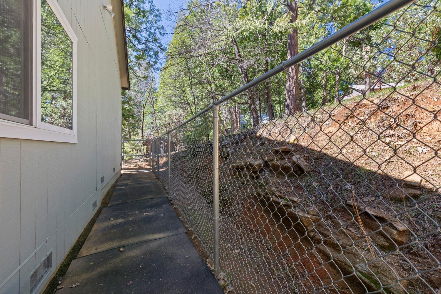 24014 Pine Cone Road Twain Harte, CA 95383 - Photo 31 of 43 a view of a pathway of a house with wooden stairs