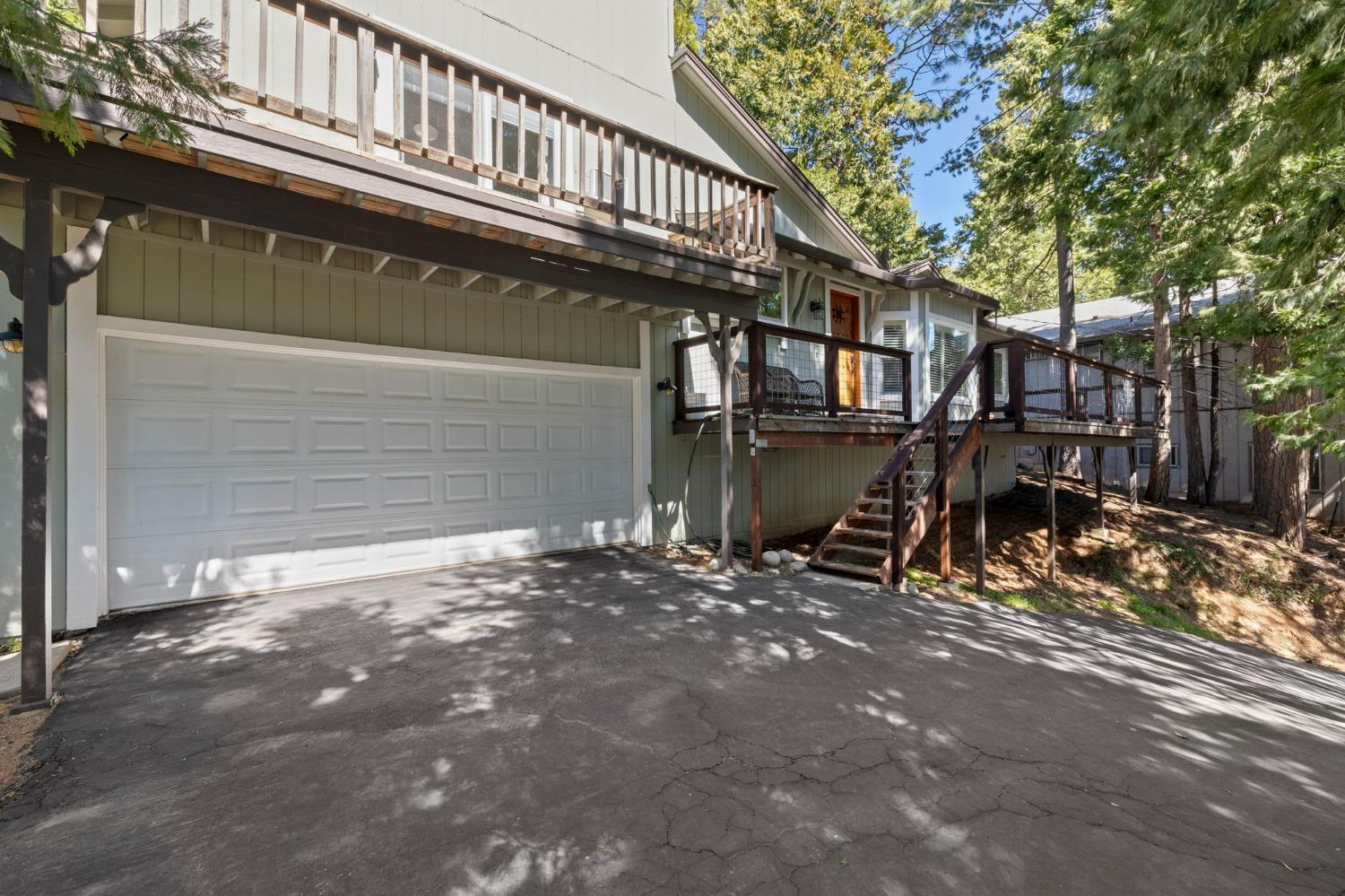 24014 Pine Cone Road Twain Harte, CA 95383 - Photo 38 of 43 a view of a house with a yard and garage