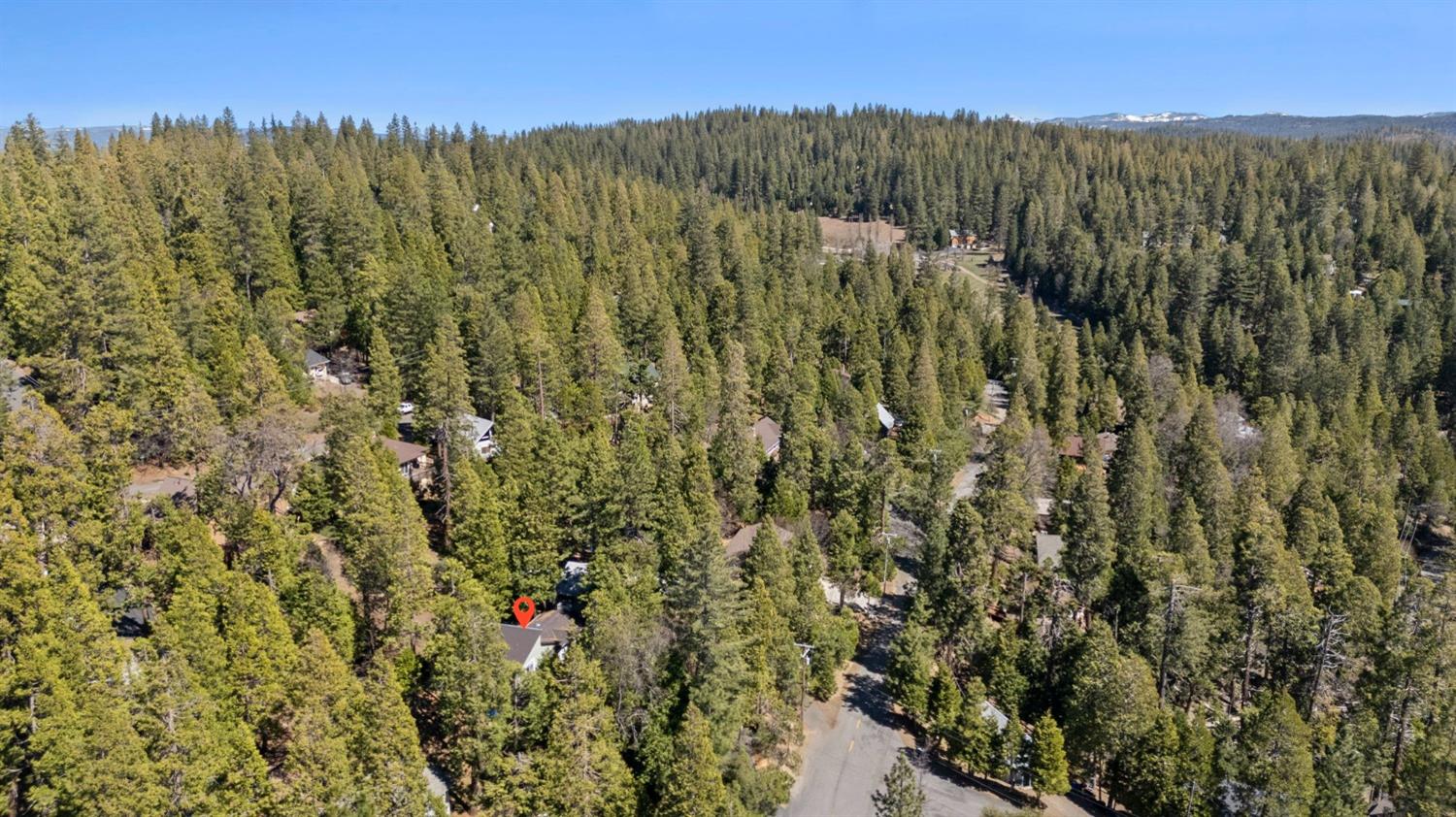 24014 Pine Cone Road Twain Harte, CA 95383 - Photo 41 of 43 a view of a lush green forest with a mountain