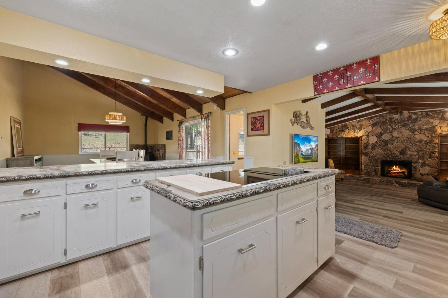 24014 Pine Cone Road Twain Harte, CA 95383 - Photo 5 of 43 a kitchen with granite countertop a sink and cabinets