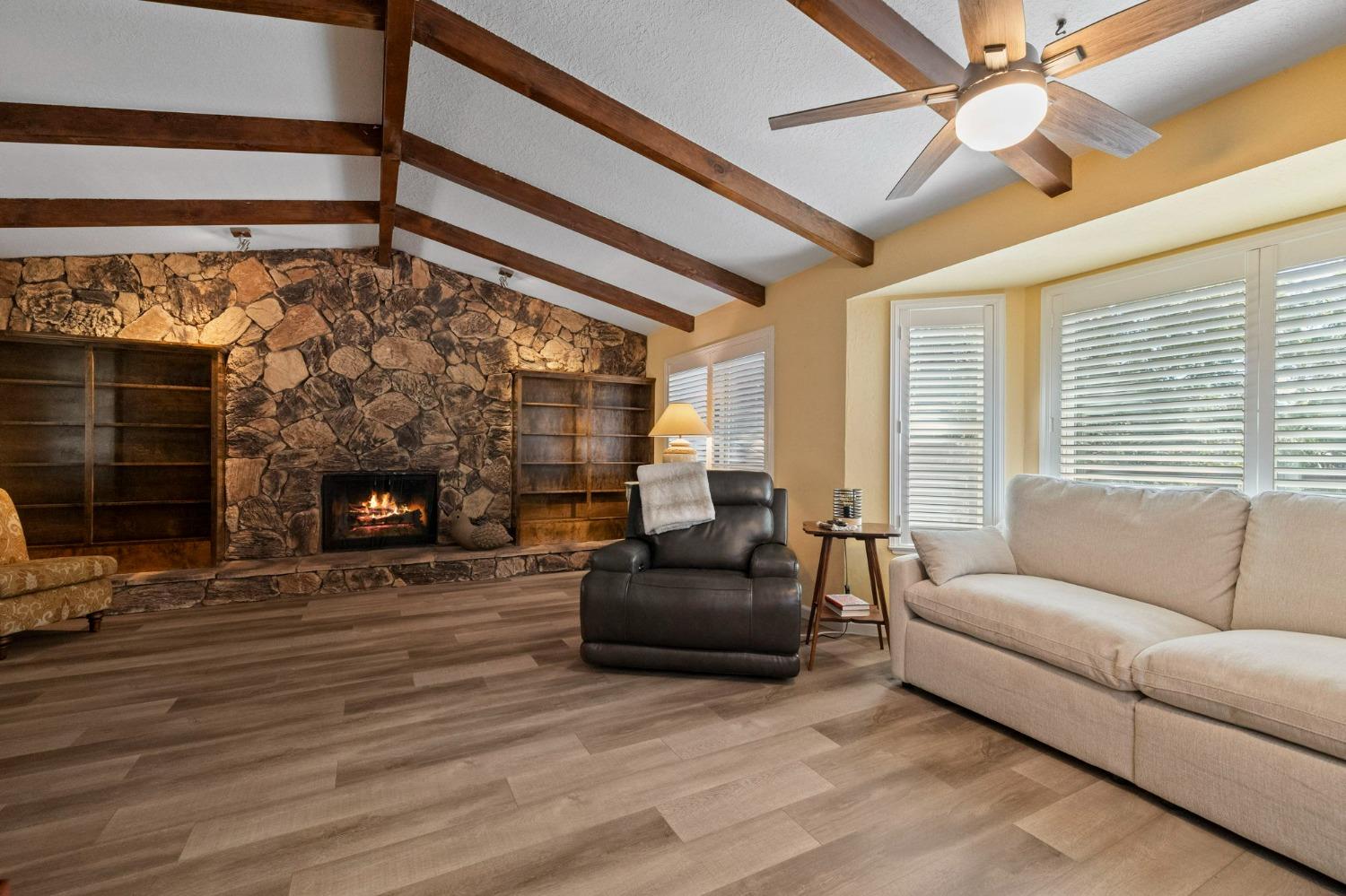 24014 Pine Cone Road Twain Harte, CA 95383 - Photo 7 of 43 a living room with furniture and a fireplace