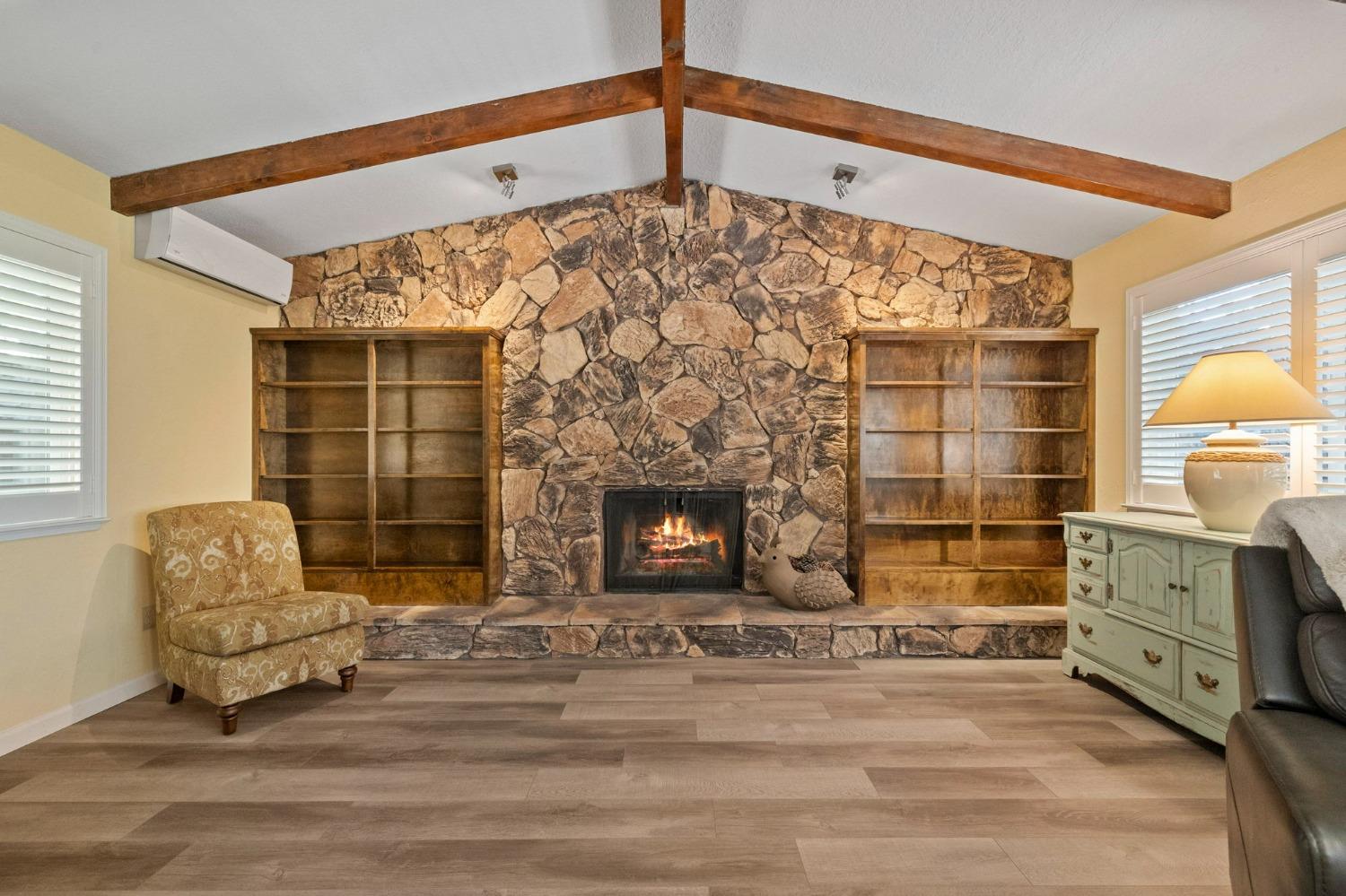 24014 Pine Cone Road Twain Harte, CA 95383 - Photo 8 of 43 a living room with furniture and a fireplace