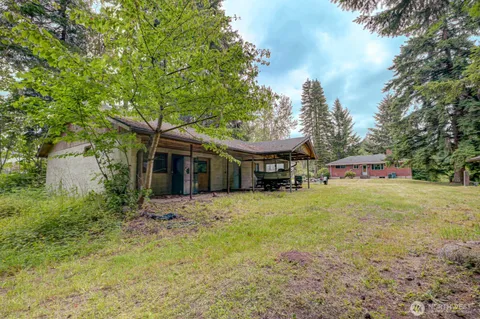 a bathroom with a shower and a sink