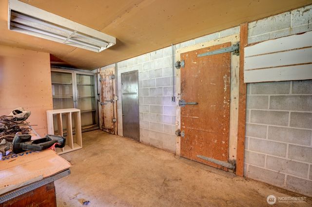 a bathroom with a shower and a sink