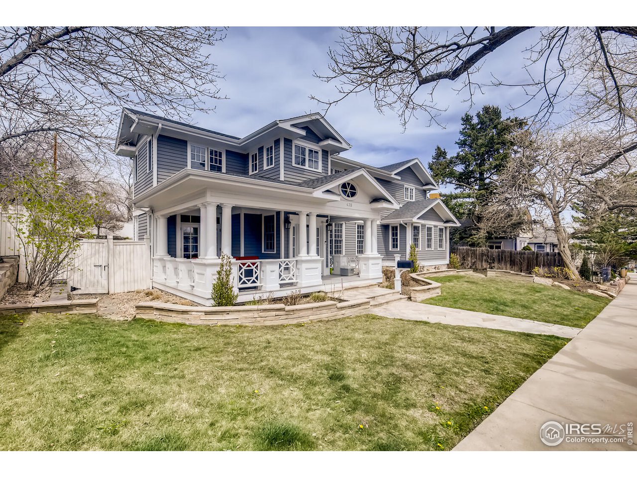 a front view of house with yard and seating area