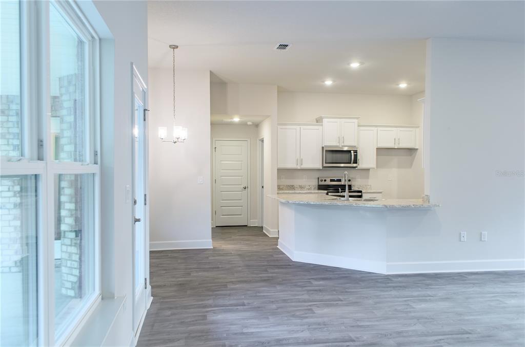 5 Red Clover Lane Palm Coast, FL 32164 - Photo 15 of 38 a view of kitchen with stainless steel appliances granite countertop a refrigerator and a sink