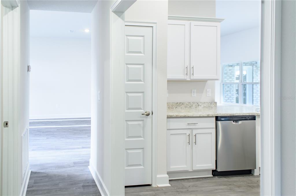 5 Red Clover Lane Palm Coast, FL 32164 - Photo 20 of 38 a kitchen with white cabinets and sink