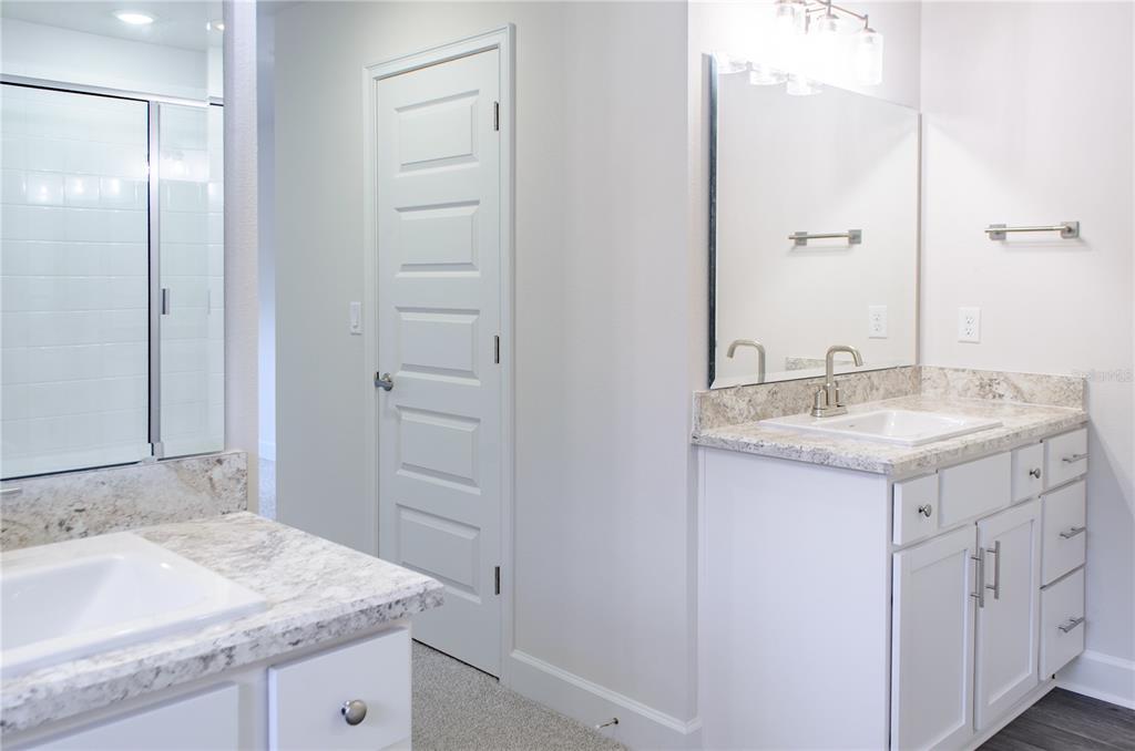 5 Red Clover Lane Palm Coast, FL 32164 - Photo 33 of 38 a bathroom with a granite countertop sink and a mirror