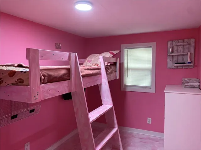 a view of a room with furniture and window