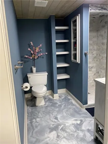 a bathroom with a toilet and a sink