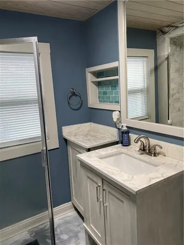 a bathroom with a sink and a mirror