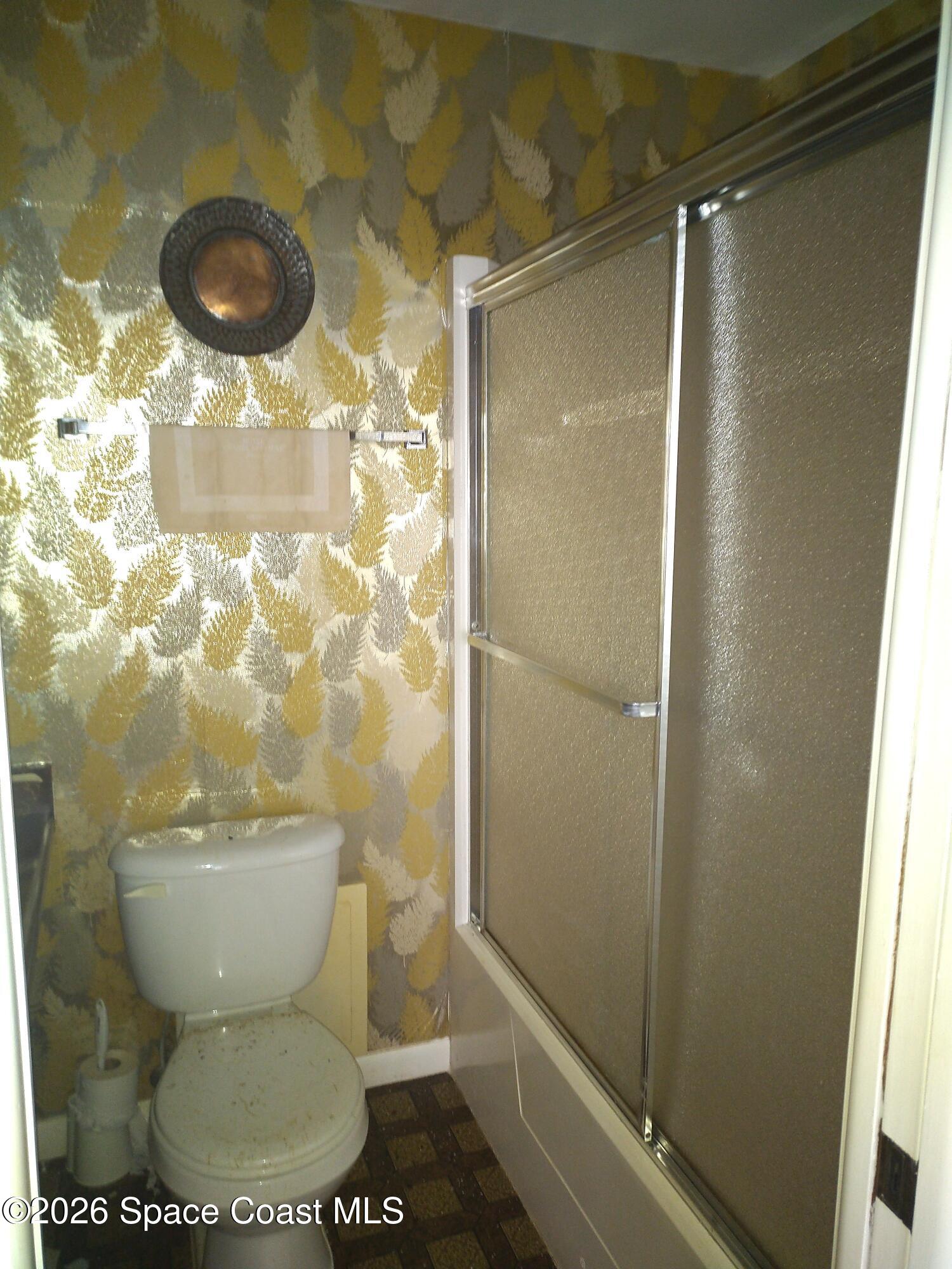 229 Kings Way Satellite Beach, FL 32937 - Photo 11 of 13 a bathroom with a toilet and a shower