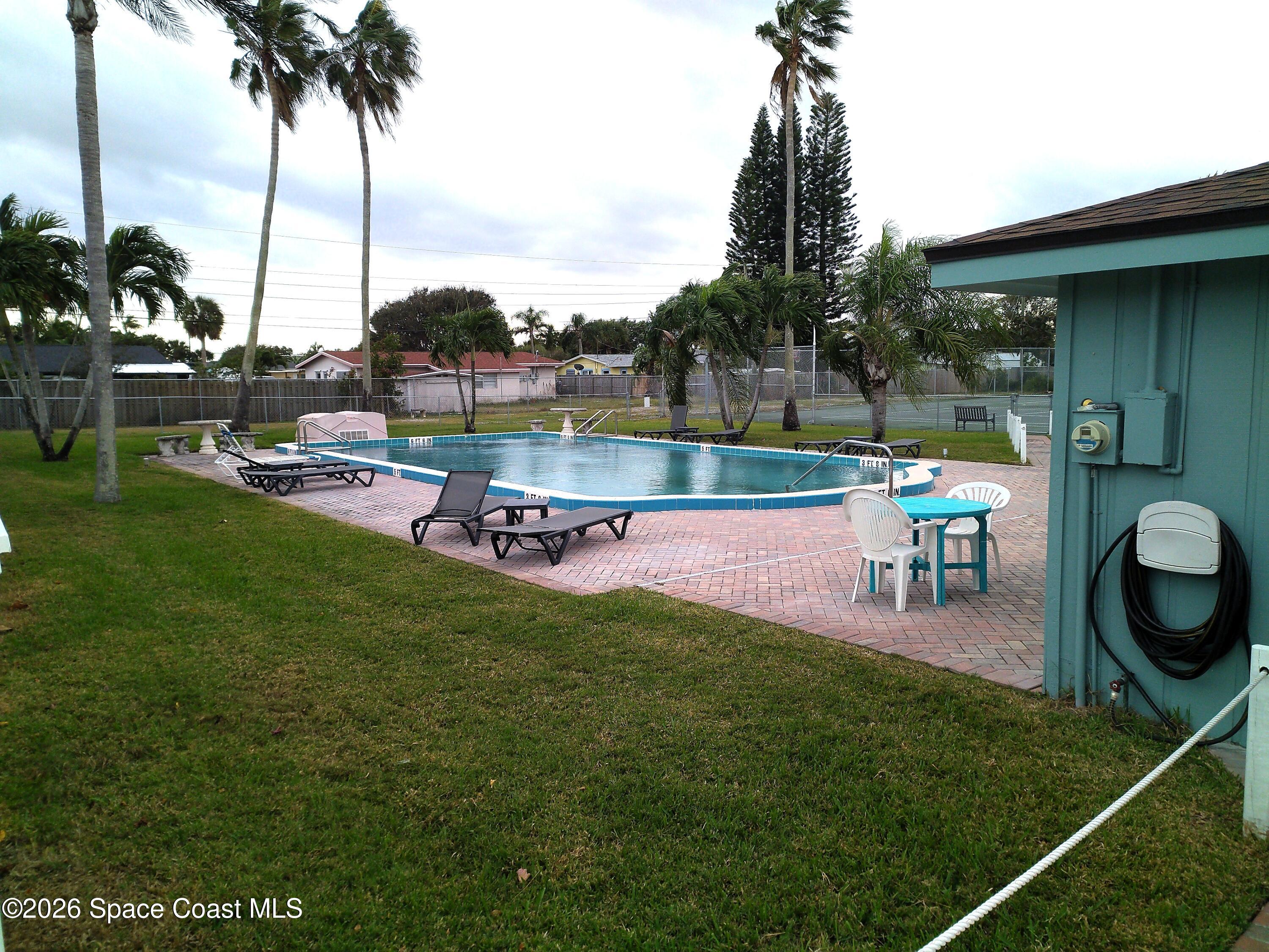 229 Kings Way Satellite Beach, FL 32937 - Photo 12 of 13 a garden view with a sitting space