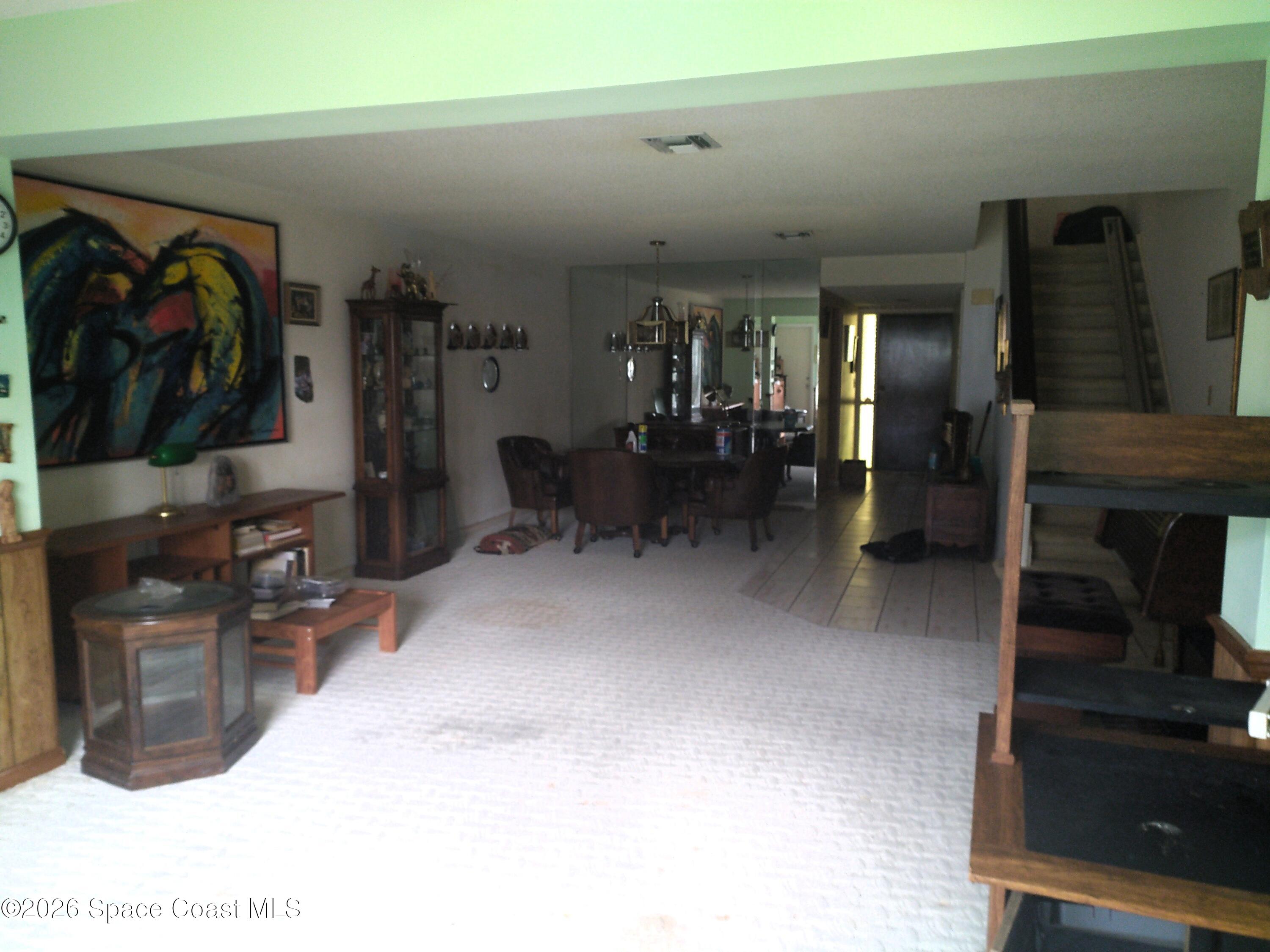 229 Kings Way Satellite Beach, FL 32937 - Photo 3 of 13 a view of a livingroom with furniture and a flat screen tv
