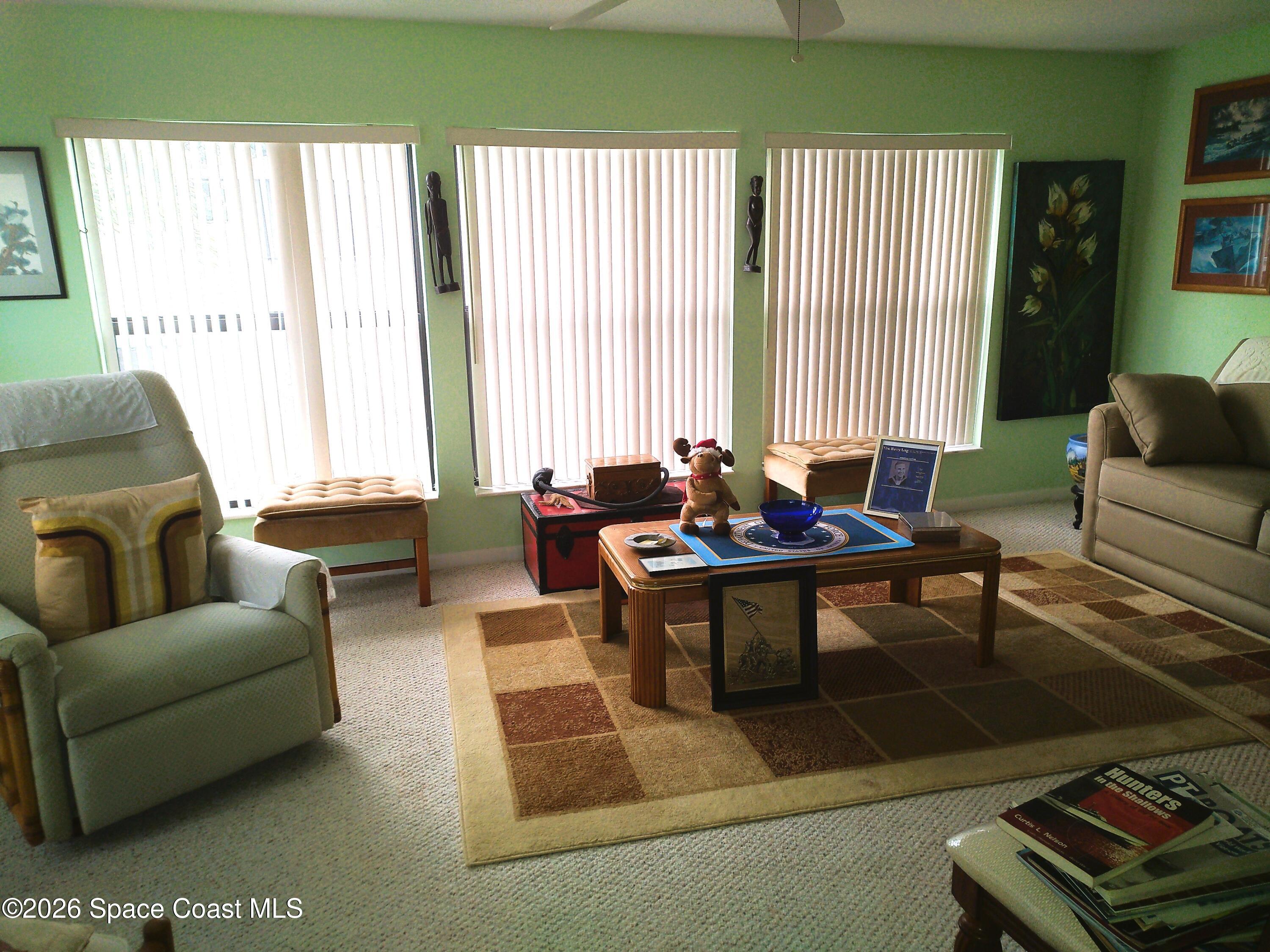 229 Kings Way Satellite Beach, FL 32937 - Photo 6 of 13 a living room with furniture and a large window
