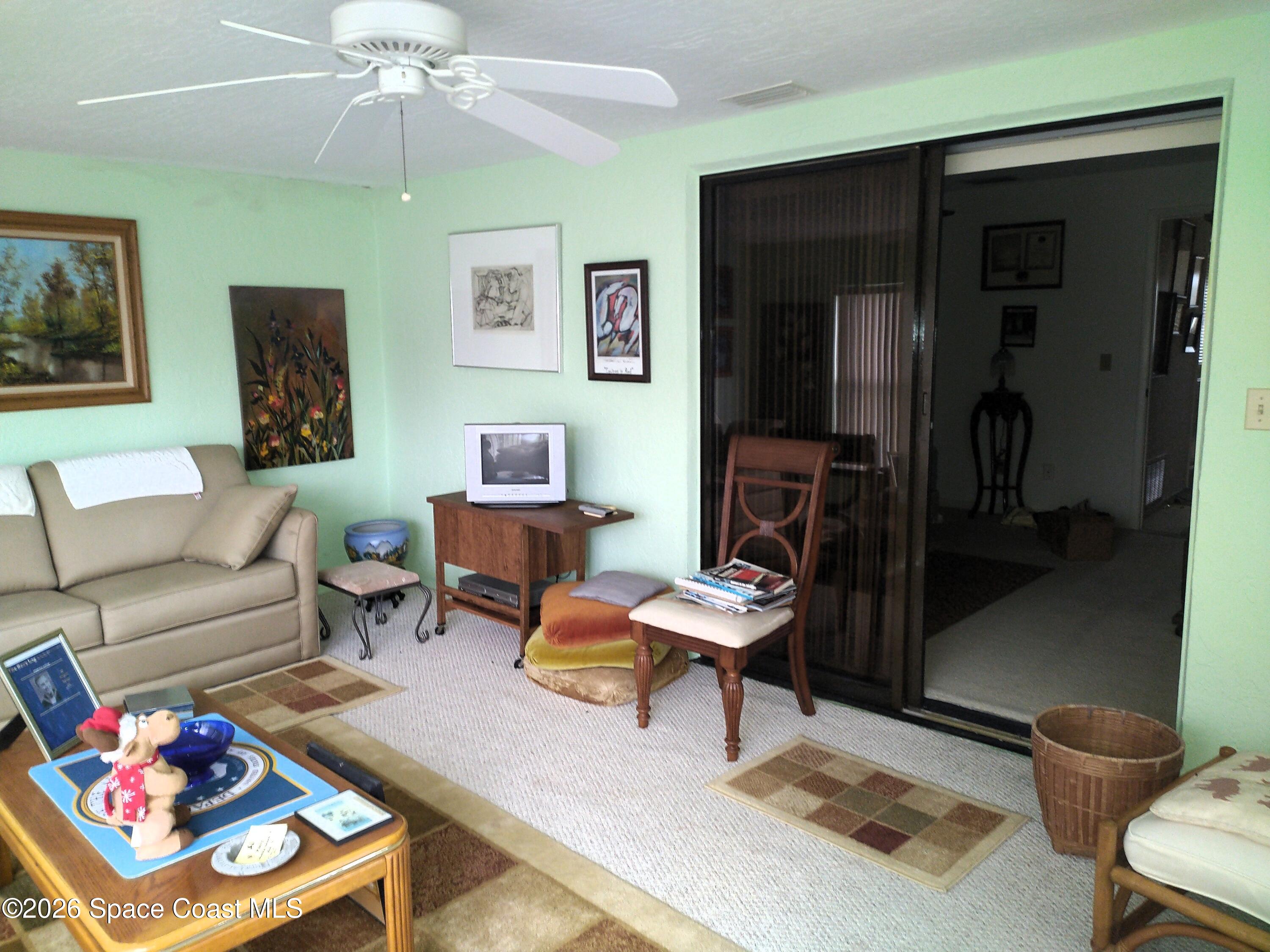 229 Kings Way Satellite Beach, FL 32937 - Photo 7 of 13 a living room with furniture and a chandelier