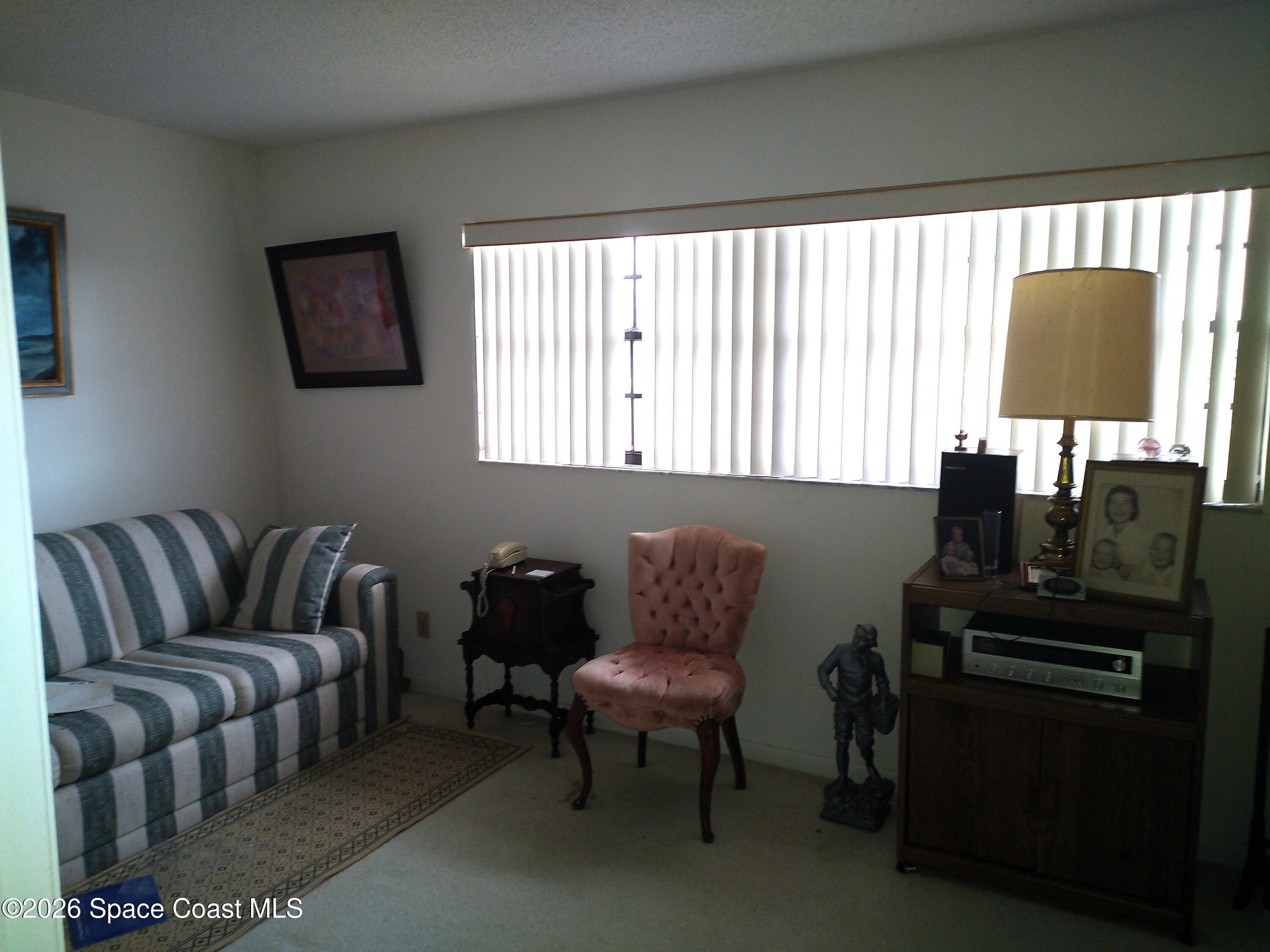 229 Kings Way Satellite Beach, FL 32937 - Photo 8 of 13 a living room with furniture and a lamp