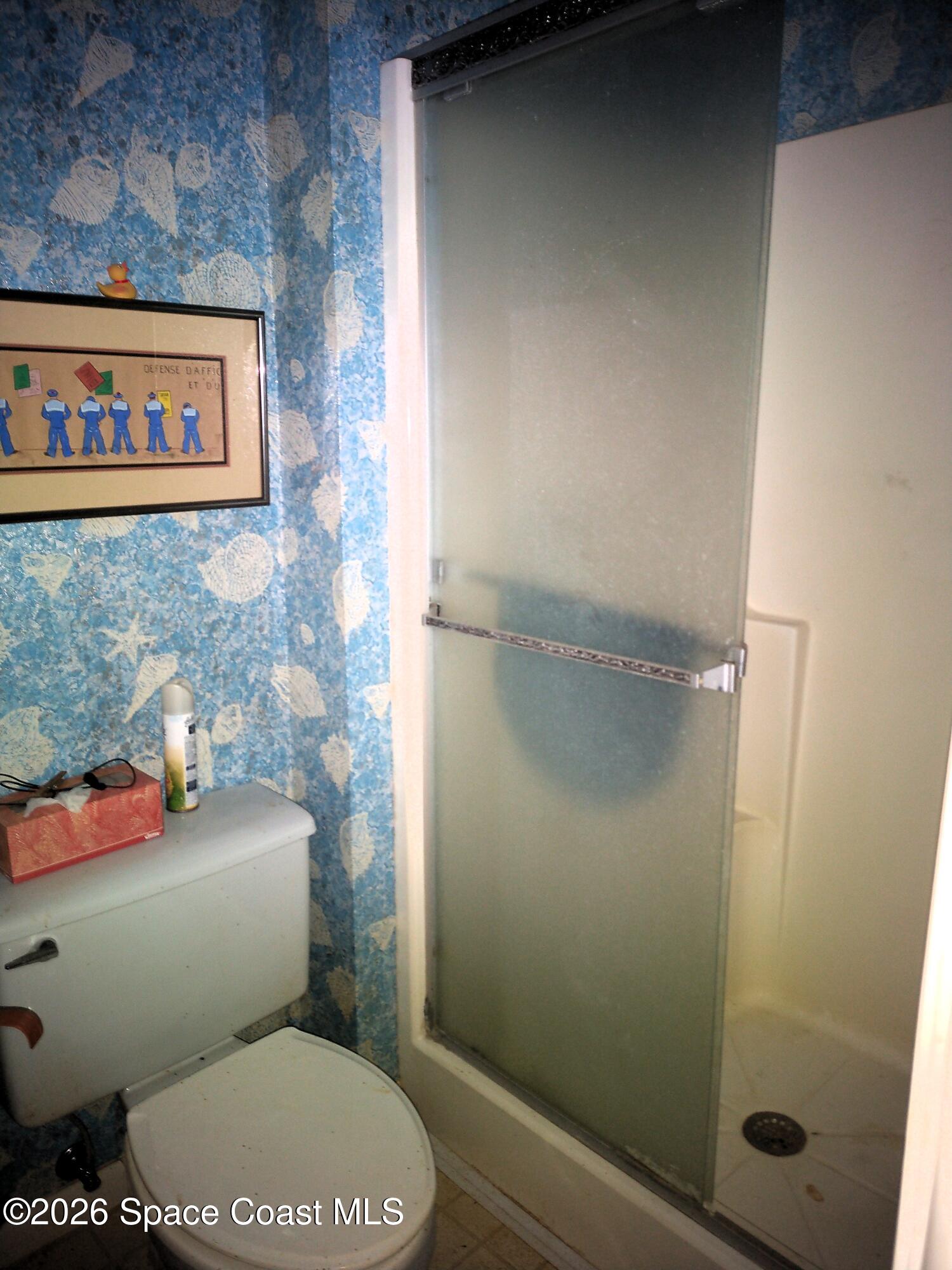 229 Kings Way Satellite Beach, FL 32937 - Photo 9 of 13 a bathroom with a toilet and a shower