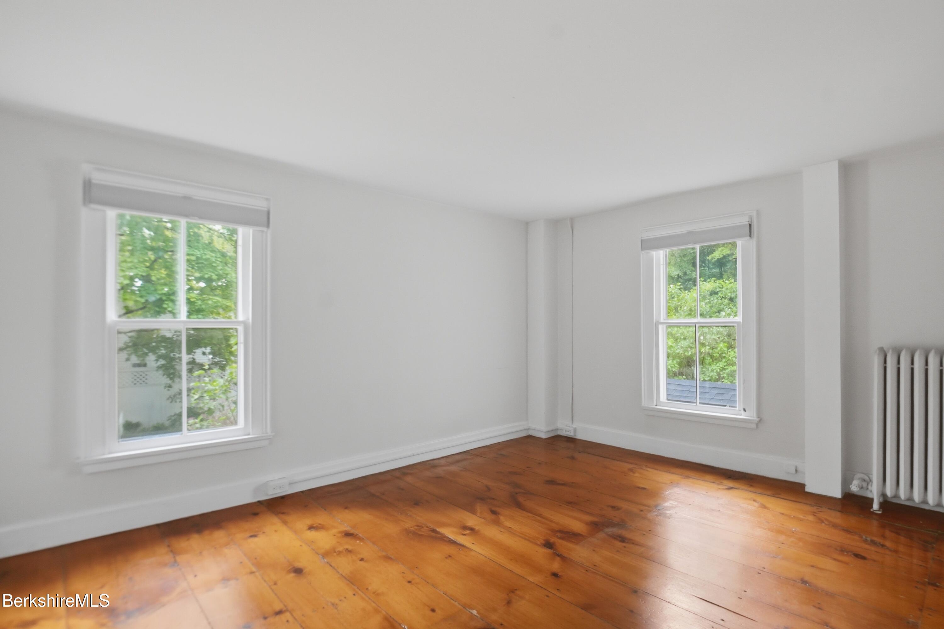 4 Stockbridge Road West Stockbridge, MA 01266 - Photo 65 of 94 an empty room with wooden floor and windows