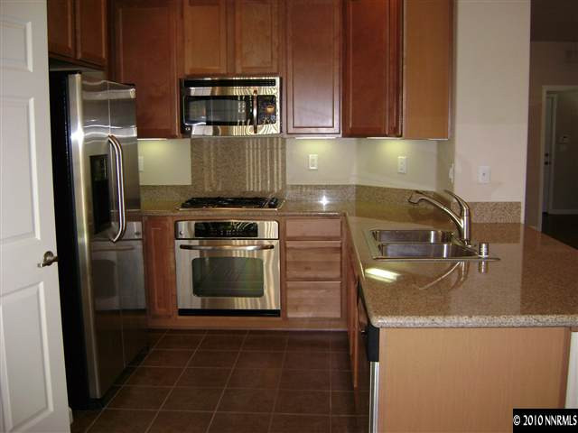 1845 A Wind Ranch Road Reno, NV 89521 - Photo 2 of 9 a kitchen with a stove and a microwave