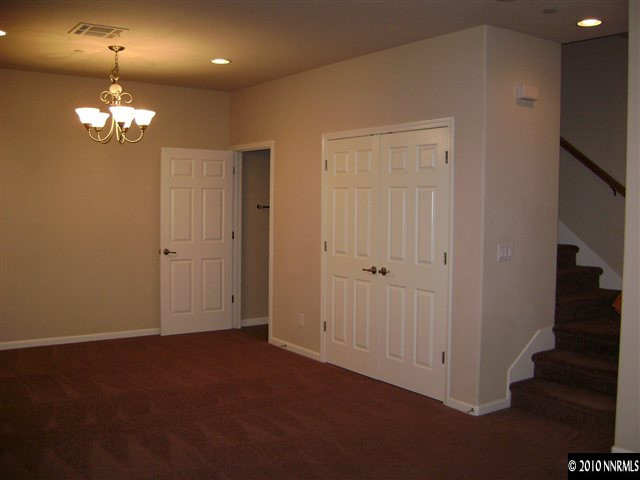 1845 A Wind Ranch Road Reno, NV 89521 - Photo 5 of 9 a view of a livingroom with a ceiling fan