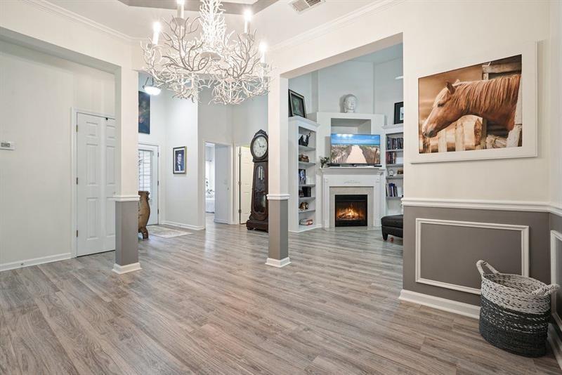 2521 Eden Ridge Lane, Unit 7 Acworth, GA 30101 - Photo 11 of 47 a view of a livingroom with wooden floor and fireplace