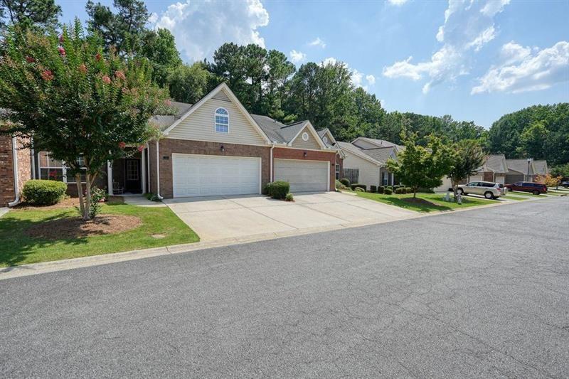 2521 Eden Ridge Lane, Unit 7 Acworth, GA 30101 - Photo 2 of 47 a front view of a house with a yard and garage