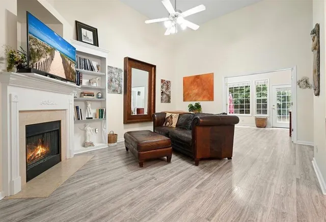 a living room with furniture and a fireplace