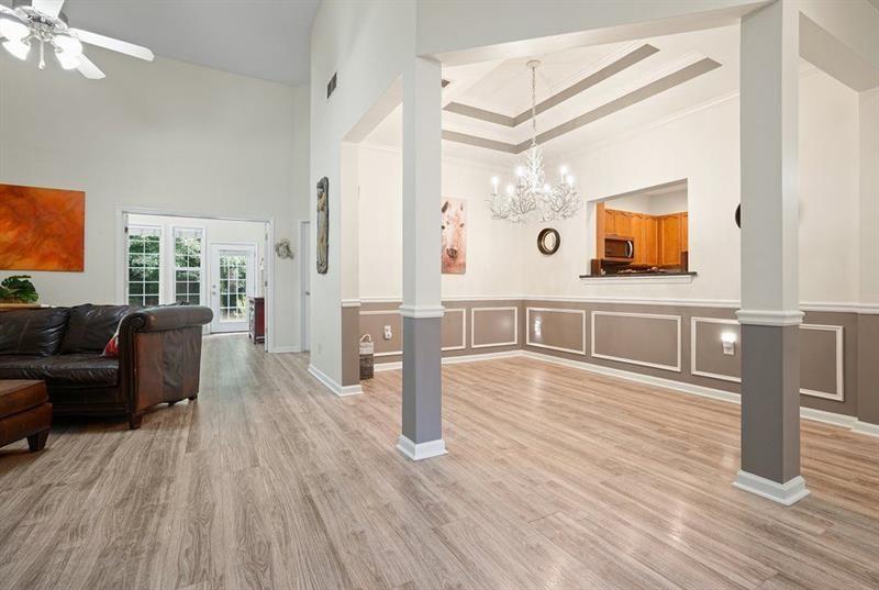 2521 Eden Ridge Lane, Unit 7 Acworth, GA 30101 - Photo 25 of 47 a living room with furniture wooden floor and a flat screen tv