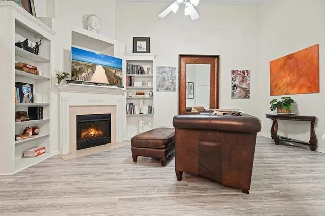 a living room with furniture and a fireplace