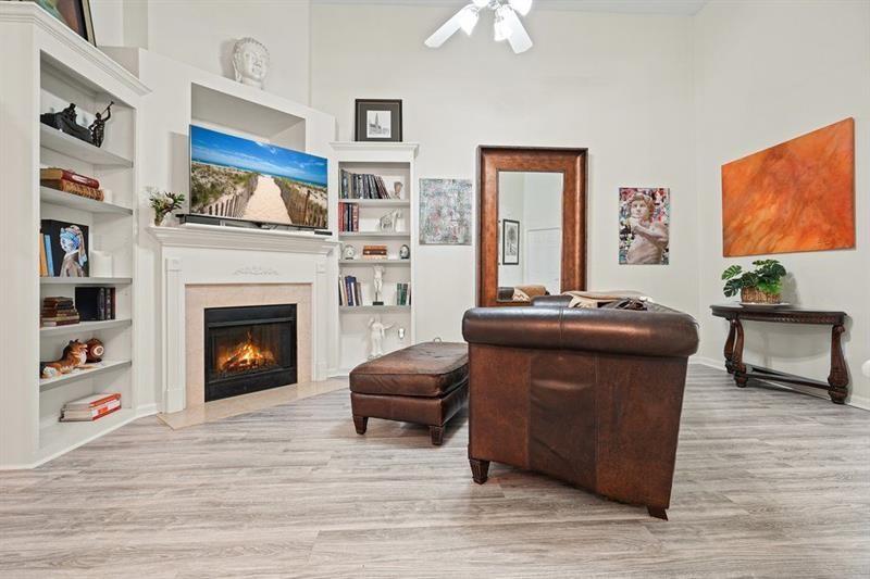2521 Eden Ridge Lane, Unit 7 Acworth, GA 30101 - Photo 27 of 47 a living room with furniture and a fireplace